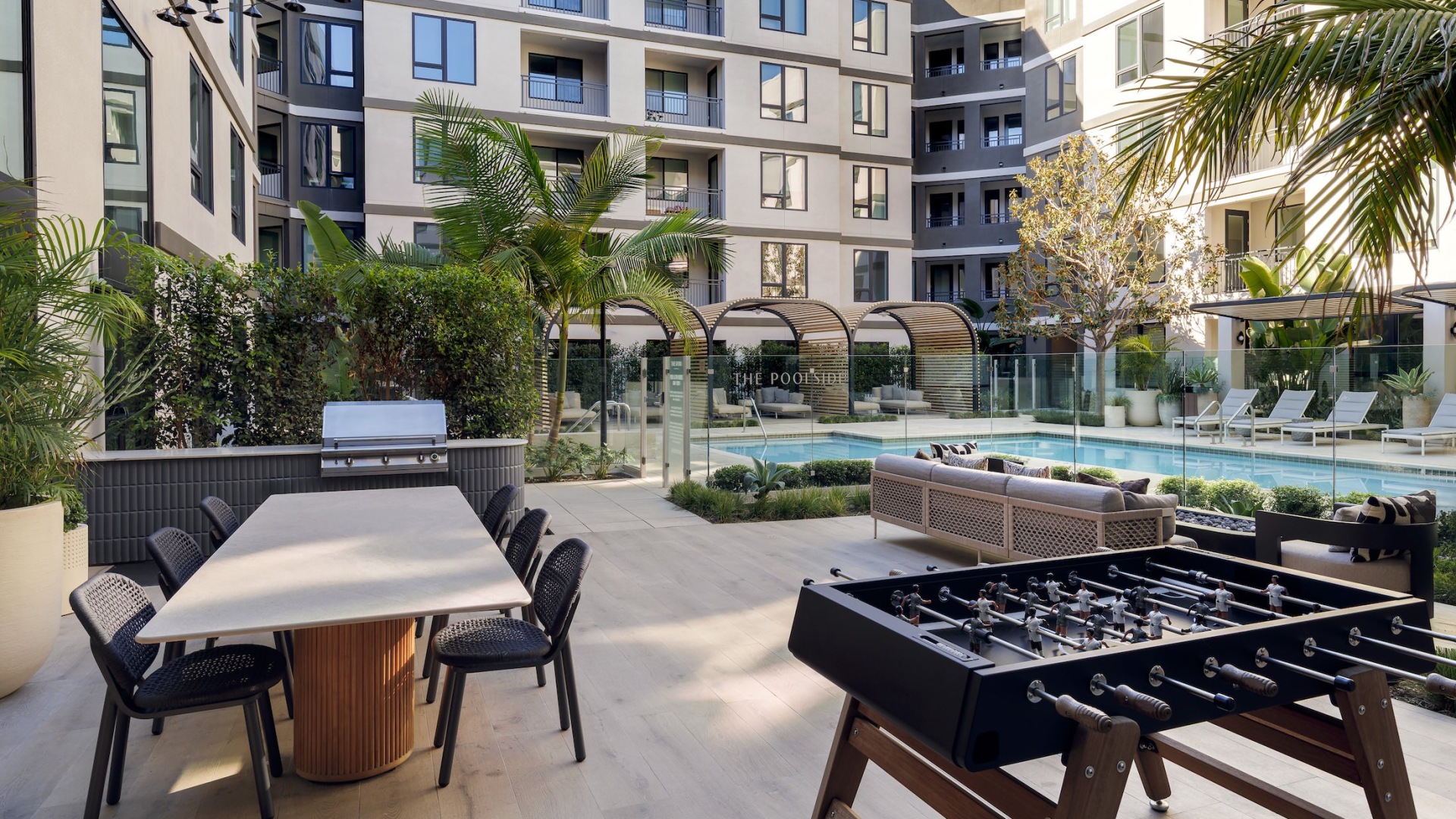 Resort-style swimming pool with lounge seating
