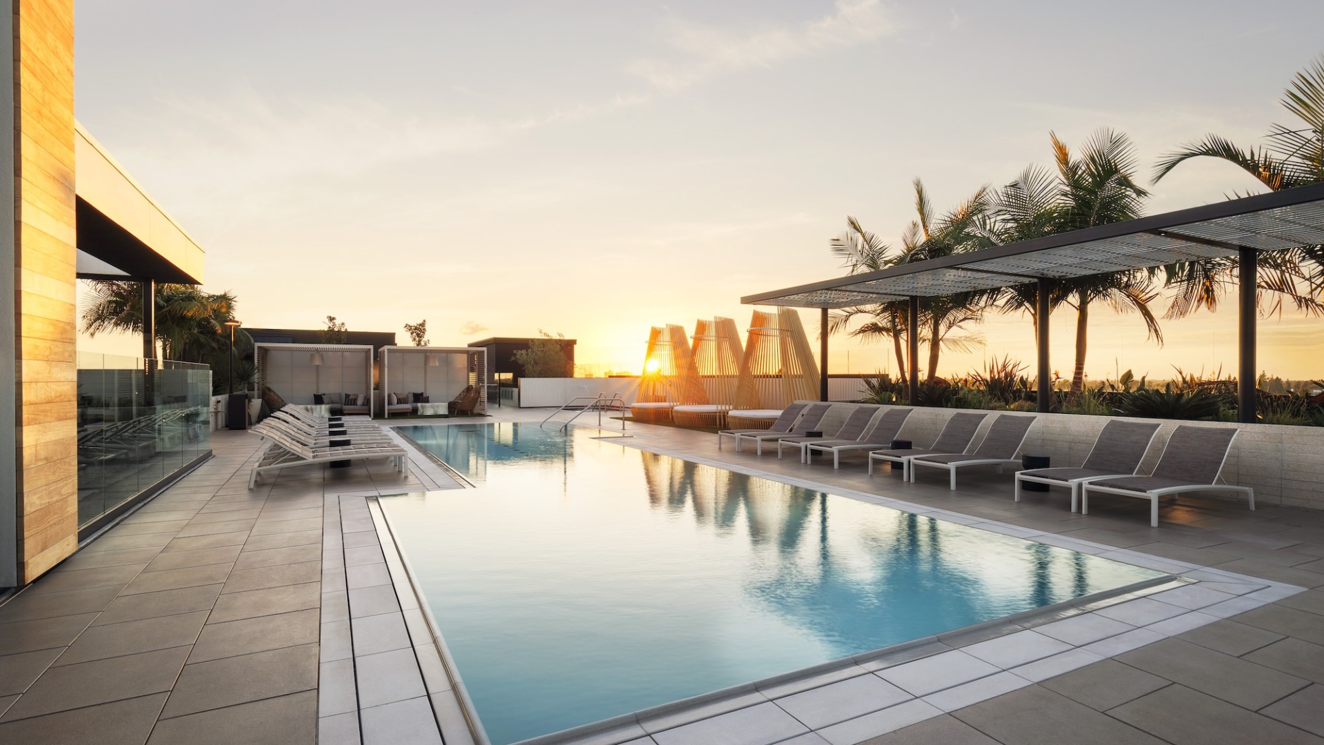 Resort-style swimming pool with lounge seating