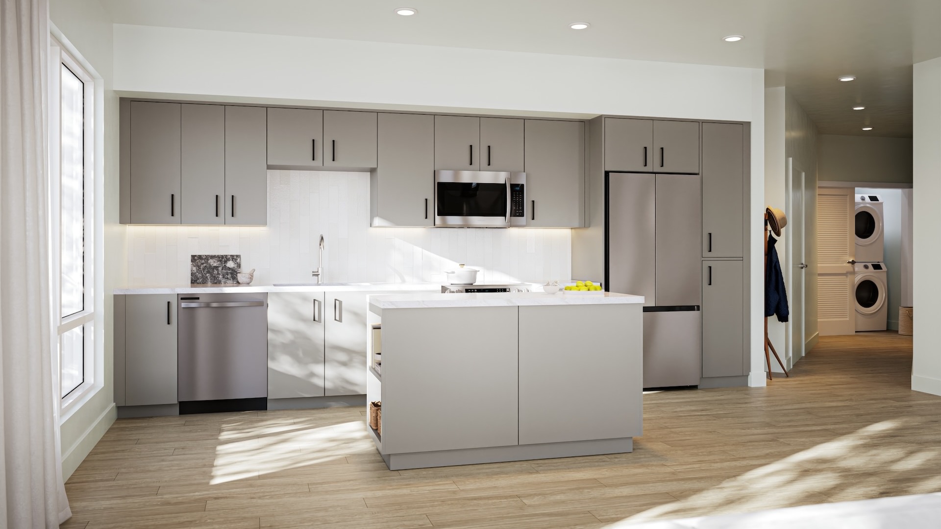 Spacious and well lit kitchen with stainless steel appliances and dark accents 