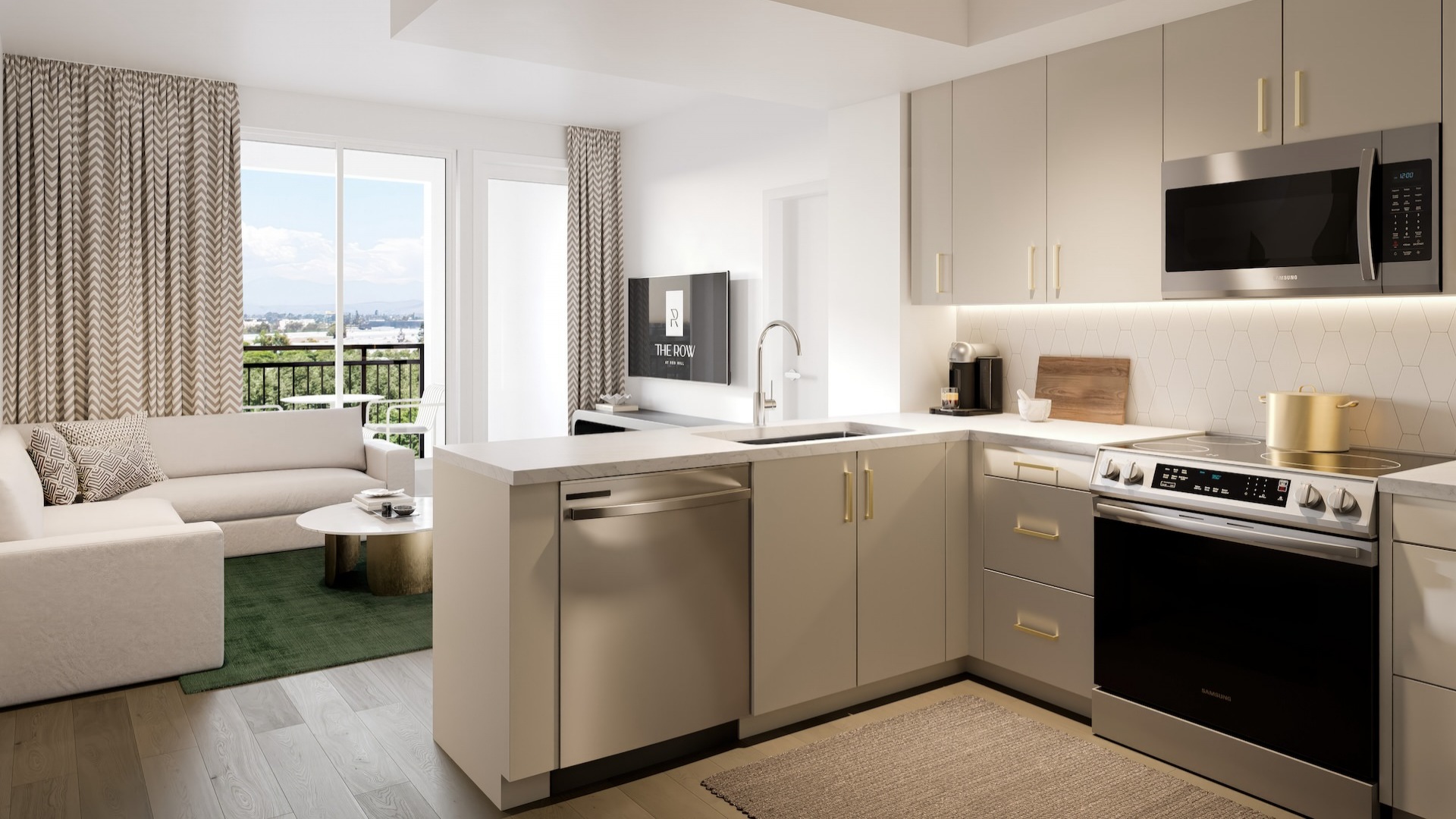 Spacious and well lit kitchen with stainless steel appliances and dark accents 