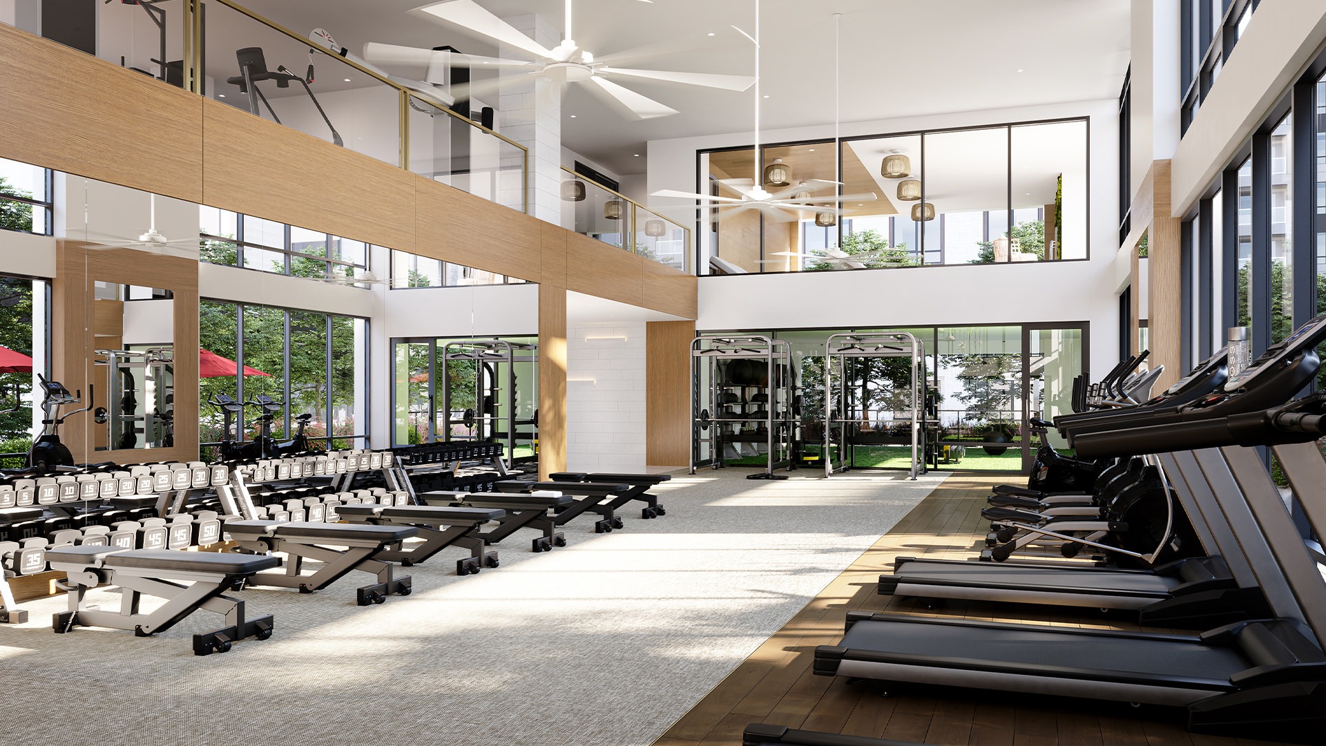 Large fitness center with large windows and plenty of equipment