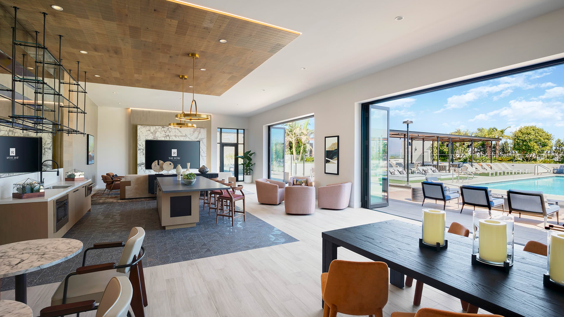 chairs and tables in social den with pool views